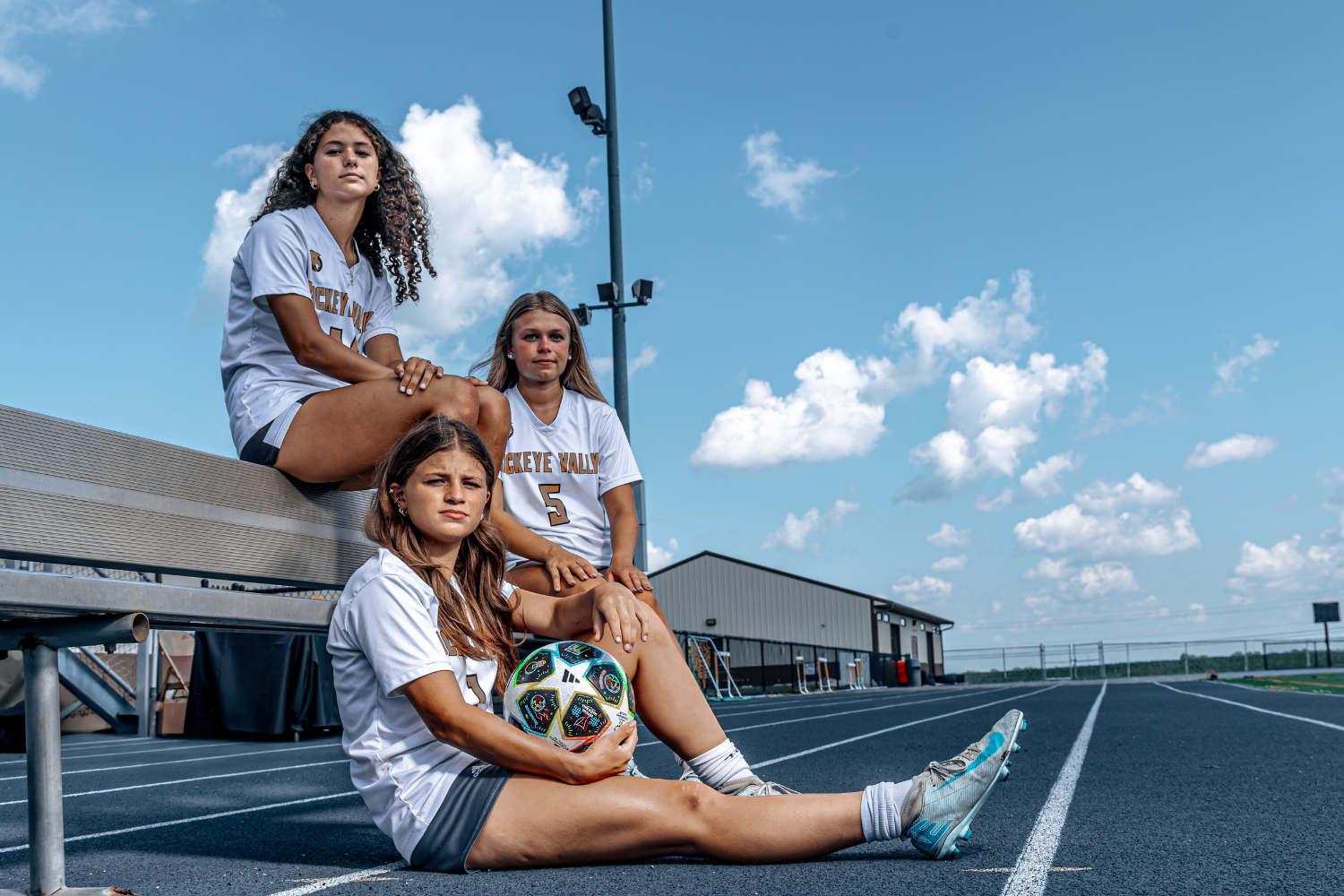 three high school soccer players
